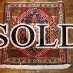 Esfahani Persian Rug Gallery
 ORIGIN: IRAN/ STYLE: SHIRAZ/ DESIGN: TRIBAL
 PILE: WOOL / FOUNDATION: WOOL
 LENGTH FT: 2.10/ WIDTH FT: 2.03/ SQF: 4.27
 LENGTH M: 0.64 / WIDTH M: 0.62SQM: 0.40
 APPROX AGE: OVER 25 YEARS / APPROX KPSI: 100
 INVENT # 1329	

